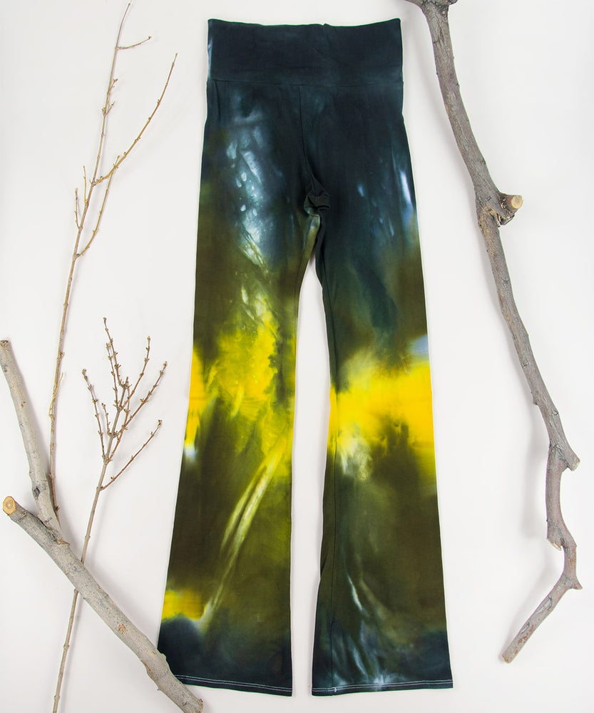 
                
                    Load image into Gallery viewer, Black + gold tie dye yoga pants by Akasha Sun.
                
            