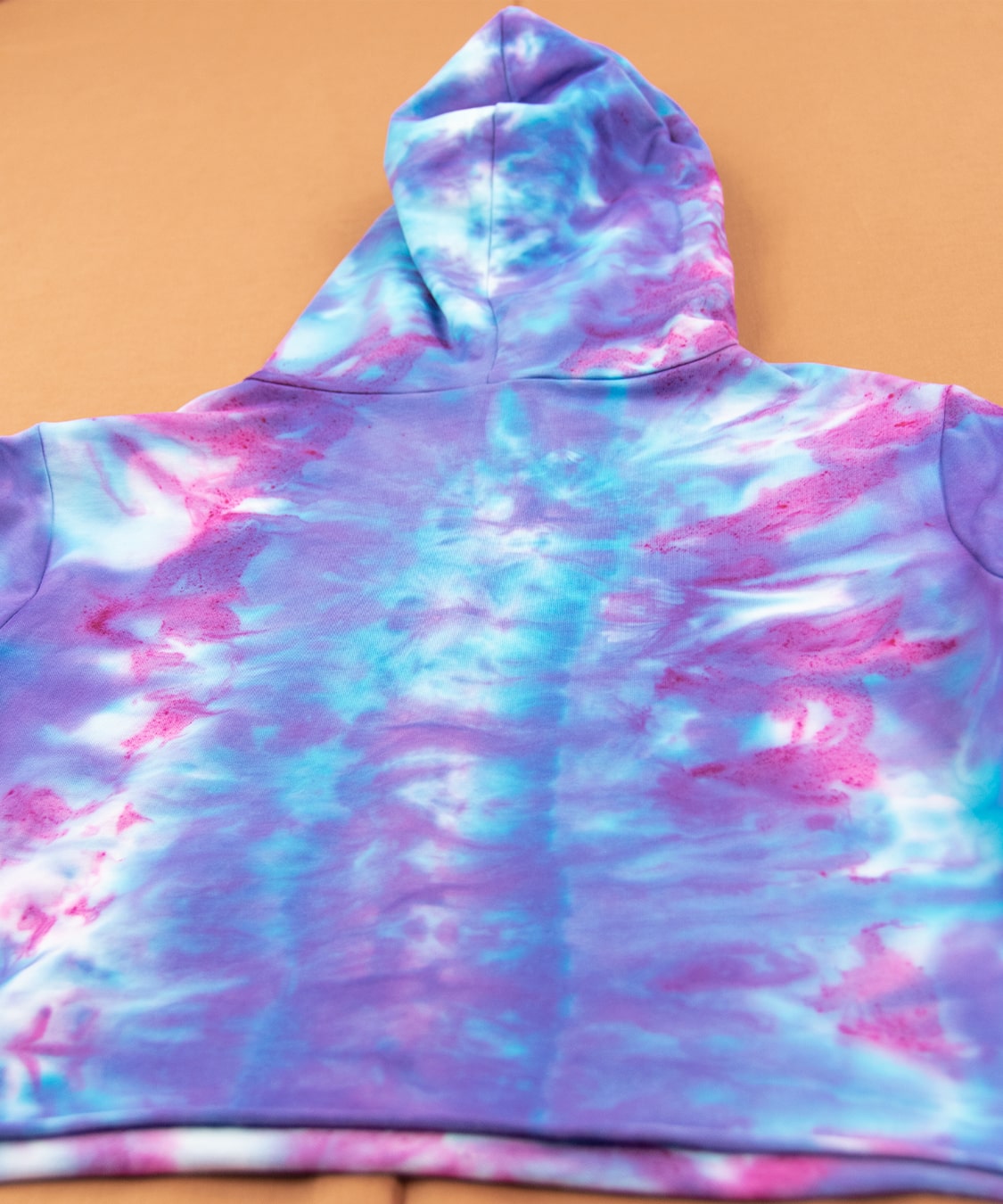 Purple and pink tie dye hoodie crop top by Akasha Sun.