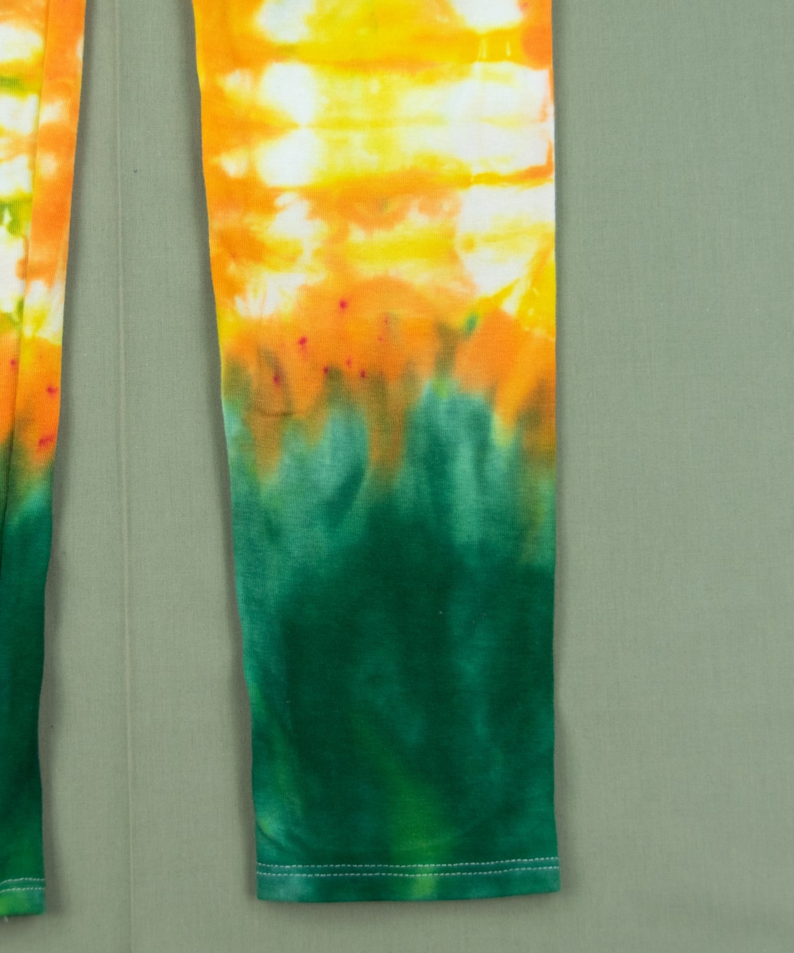 Green and yellow tie dye leggings.