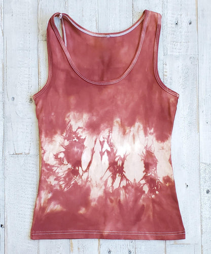 A rust tie dye tank top.