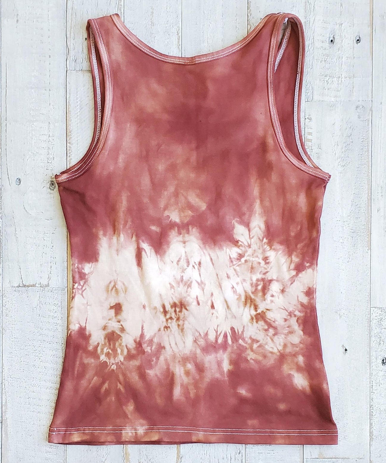 A rust tie dye tank top.