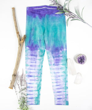 Teal and purple tie dye leggings made of sustainable cotton.