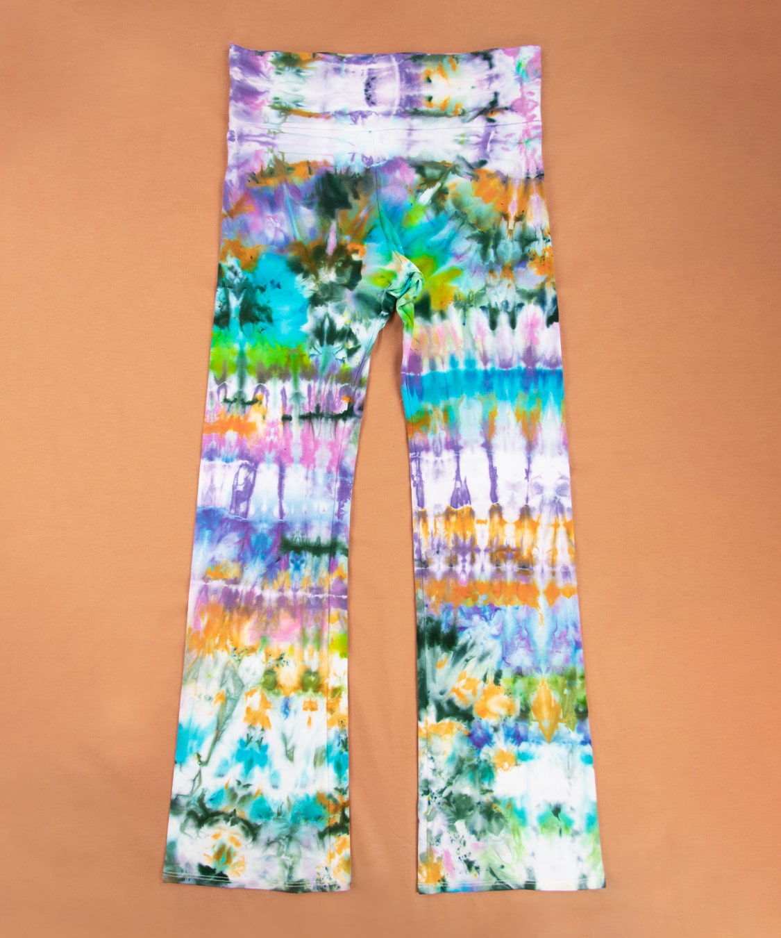 Rainbow ice dyed yoga pants with a wide waistband and flare bottoms by Akasha Sun.