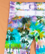 Rainbow ice dyed yoga pants with a wide waistband and flare bottoms by Akasha Sun.