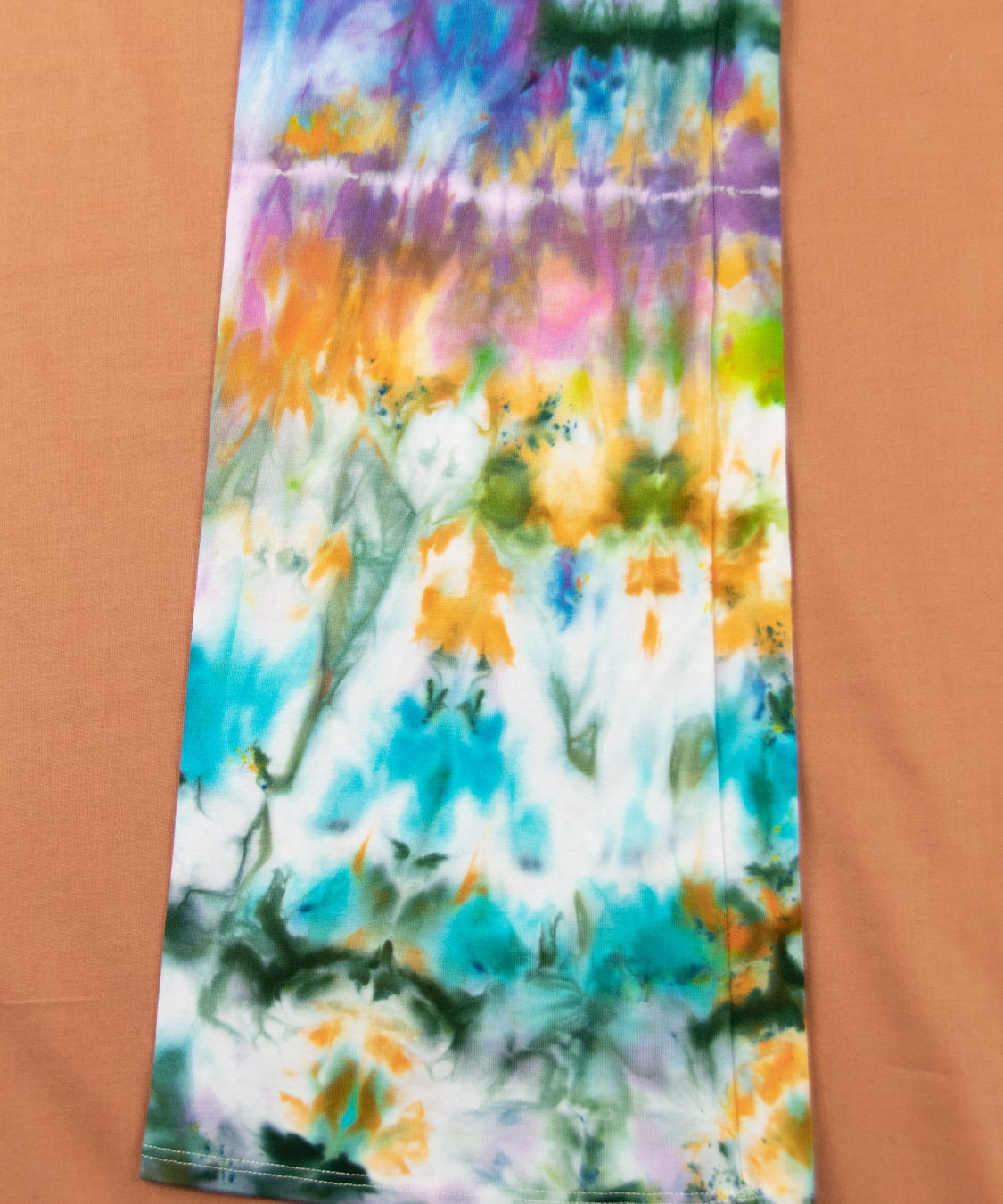 Rainbow ice dyed yoga pants with a wide waistband and flare bottoms by Akasha Sun.