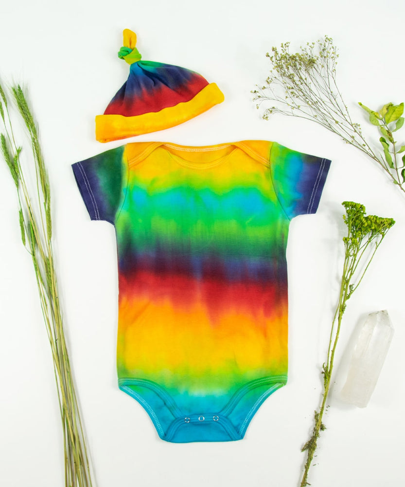 Rainbow organic cotton tie dye baby set with a baby hat and bodysuit.