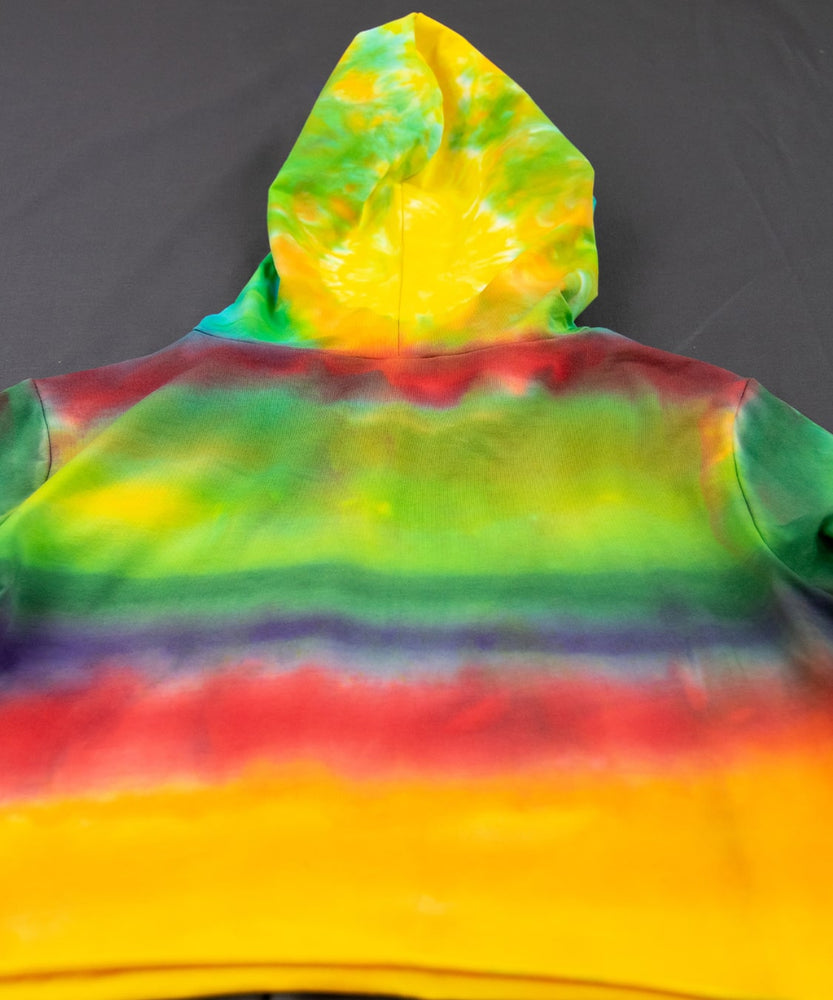 Rainbow tie dye hoodie crop top with a hood, drawstrings, and long sleeves.