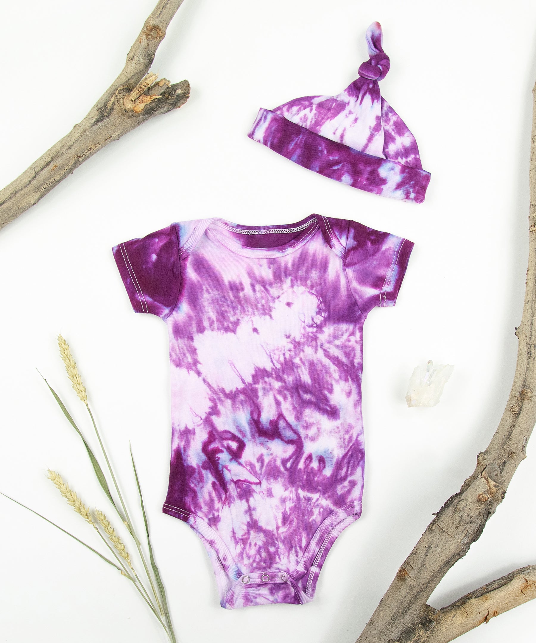 Pink tie dye bodysuit and baby hat set by Akasha Sun.  Made of organic cotton.