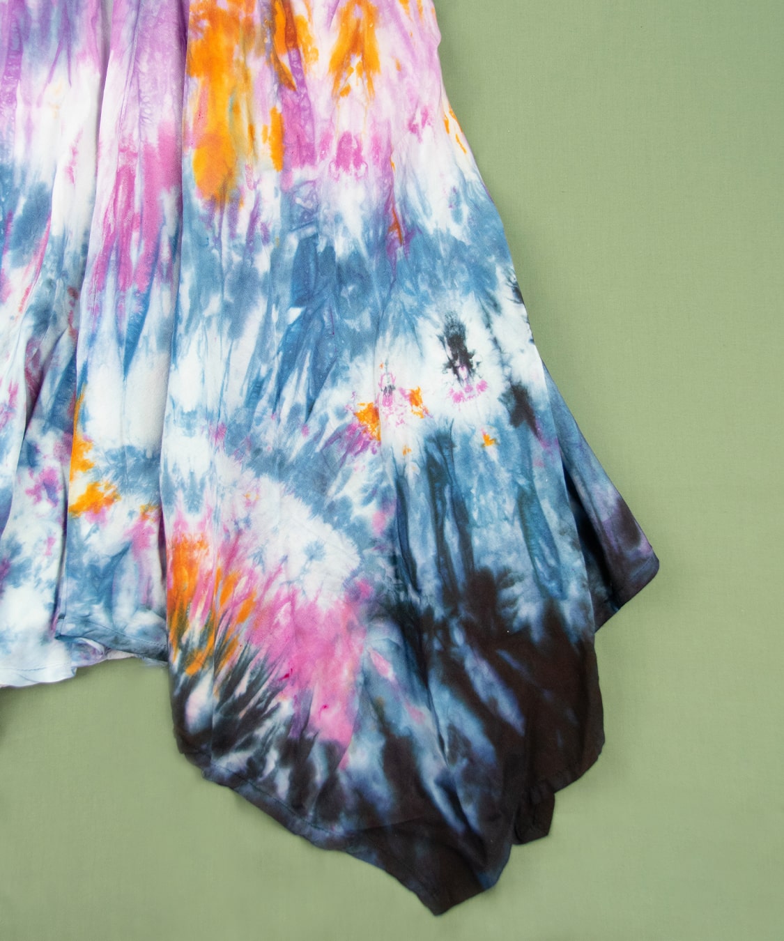 Black, blue, pink, and orange tie dye fairy dress by Akasha Sun.