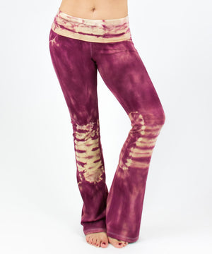 
                
                    Load image into Gallery viewer, Woman wearing a pair of rose pink tie dye yoga pants with a fold over waistband by Akasha Sun.
                
            