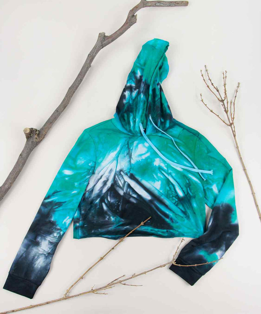 Teal + black tie dye hoodie crop top with long sleeves and an oversized hood by Akasha Sun.