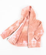 Rose gold tie dye baby jacket with a fleece interior, hood, and zipper.