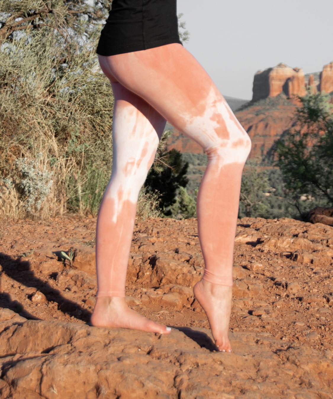 Woman wearing a pair of Sedona Sun leggings by Akasha Sun.