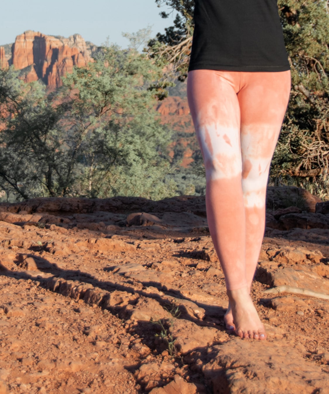 Woman wearing a pair of Sedona Sun leggings by Akasha Sun.