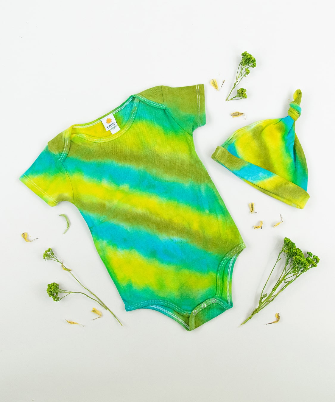 Green and blue tie dye organic cotton baby bodysuit and hat set by Akasha Sun.