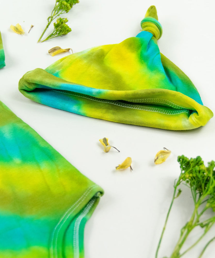 Green and blue tie dye organic cotton baby bodysuit and hat set by Akasha Sun.