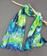 Navy blue, teal, and green tie dye scarf.