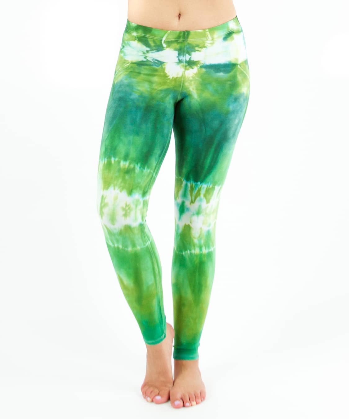 Woman wearing a pair of green tie dye leggings by Akasha Sun.