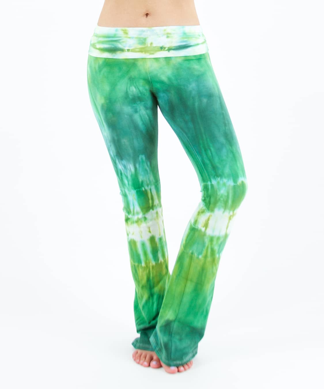 Woman wearing a pair of Akasha Sun fold over green tie dye yoga pants.