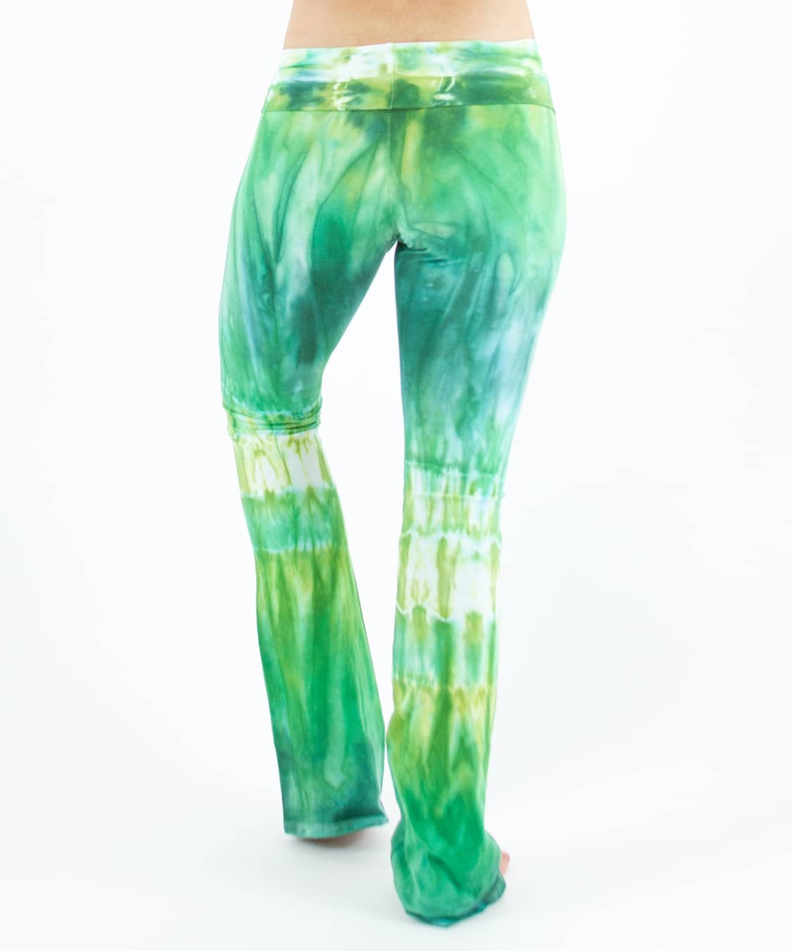 Woman wearing a pair of Akasha Sun fold over green tie dye yoga pants.