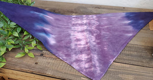 A dog modeling our tie dye dog bandana in purple.
